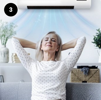 Woman relaxing under cool air breeze from EpiCooler wall air conditioner in living room – step 3 enjoy comfort