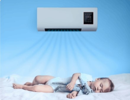 Baby sleeping peacefully under gentle cool airflow from EpiCooler wall air conditioner – silent and safe for children